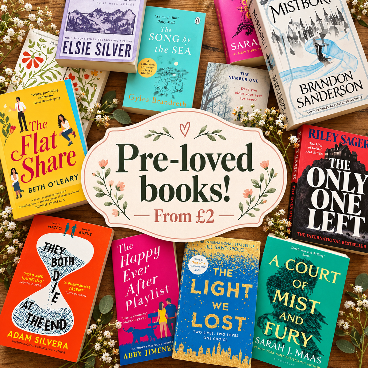 Pre-loved books spread on a wooden table, from £2